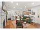 Bright living room featuring hardwood floors, open floor plan and stylish furniture and doorway to bedroom at 2410 Huron St, Durham, NC 27707