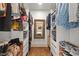 Walk-in closet with wooden floors, custom shelving, drawers, and a decorative mirror at 2410 Huron St, Durham, NC 27707
