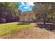 View of the expansive backyard with trampoline and storage shed at 2555 Winding Creek Ln, Franklinton, NC 27525
