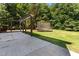 Spacious backyard features patio, pergola, and trampoline at 2555 Winding Creek Ln, Franklinton, NC 27525