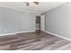 Spacious bedroom featuring neutral walls, wood-look floors, and a walk-in closet at 2555 Winding Creek Ln, Franklinton, NC 27525