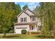 Charming two-story home featuring a well-maintained lawn and an attached two-car garage at 2555 Winding Creek Ln, Franklinton, NC 27525