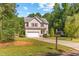 Charming two-story home featuring a well-maintained lawn and an attached two-car garage at 2555 Winding Creek Ln, Franklinton, NC 27525