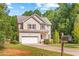 Charming two-story home featuring a well-maintained lawn and an attached two-car garage at 2555 Winding Creek Ln, Franklinton, NC 27525