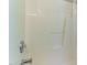 Clean white shower features a built-in shelf for storage at 2555 Winding Creek Ln, Franklinton, NC 27525