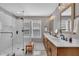 Bright bathroom with walk-in shower with glass door, a double sink vanity and great natural light at 2605 Bloomsberry Ridge Dr, Fuquay Varina, NC 27526