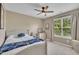 Bedroom featuring carpet, natural light, a ceiling fan, and a blue color scheme at 2605 Bloomsberry Ridge Dr, Fuquay Varina, NC 27526