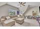 Spacious bonus room with a comfortable sectional sofa, fun décor, and ample natural light at 2605 Bloomsberry Ridge Dr, Fuquay Varina, NC 27526