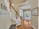 Bright foyer with hardwood floors, elegant staircase, and welcoming decor at 2605 Bloomsberry Ridge Dr, Fuquay Varina, NC 27526