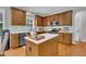 Well-lit kitchen with a center island, stainless steel appliances, and ample counter space at 2605 Bloomsberry Ridge Dr, Fuquay Varina, NC 27526
