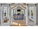 Sunroom with stone fireplace, vaulted ceilings, and a comfortable seating area at 2605 Bloomsberry Ridge Dr, Fuquay Varina, NC 27526