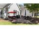 Backyard patio area with a porch swing and plenty of room to grill and relax at 2813 Greenridge View Ln, Zebulon, NC 27597