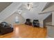 Large bonus room with vaulted ceilings, lots of ceiling fans, and plenty of space to relax at 2813 Greenridge View Ln, Zebulon, NC 27597
