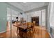 Spacious dining area showcases wooden table, pillars, and hardwood floors at 2813 Greenridge View Ln, Zebulon, NC 27597