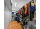 Walk-in closet with custom shelving, racks, and wood flooring at 2813 Greenridge View Ln, Zebulon, NC 27597