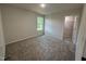 Cozy bedroom with soft carpet and a bright window providing natural light at 299 Starry Sky Dr, Benson, NC 27504