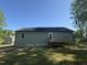Home exterior with a wood deck overlooking a yard at 299 Starry Sky Dr, Benson, NC 27504