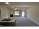Inviting living room open to the kitchen, featuring a fireplace and modern finishes at 299 Starry Sky Dr, Benson, NC 27504
