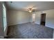 Spacious main bedroom with plush carpet and a ceiling fan at 299 Starry Sky Dr, Benson, NC 27504