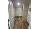 Open walk-in closet with wood floor and wire shelving ready for organization at 299 Starry Sky Dr, Benson, NC 27504