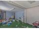 Messy room with blue walls, debris, and furniture, showcasing the need for renovation at 301 N King Charles Rd, Raleigh, NC 27610