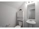 Small bathroom featuring a pedestal sink, toilet and mirror at 304 Garden Walk Dr, Durham, NC 27703