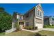 Charming home featuring neutral siding, a covered porch, and a manicured lawn, creating a welcoming curb appeal at 304 Garden Walk Dr, Durham, NC 27703