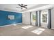 Spacious main bedroom with carpet, tray ceilings, and natural light at 304 Garden Walk Dr, Durham, NC 27703