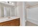 Bathroom featuring a sink vanity and shower and tub combo at 305 Avent Meadows Ln, Holly Springs, NC 27540