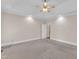 Spacious bedroom with a tray ceiling, ceiling fan, and carpeted floors at 305 Avent Meadows Ln, Holly Springs, NC 27540