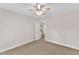 Cozy bedroom featuring carpet floors, ceiling fan and neutral walls at 305 Avent Meadows Ln, Holly Springs, NC 27540