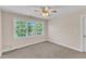 Bedroom with a large window offering plenty of natural light at 305 Avent Meadows Ln, Holly Springs, NC 27540