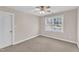Carpeted bedroom featuring a window and closet at 305 Avent Meadows Ln, Holly Springs, NC 27540