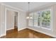 This dining area has hardwood floors, natural light, and views of the backyard at 305 Avent Meadows Ln, Holly Springs, NC 27540