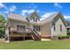 Expansive backyard showcases meticulous landscaping with lots of space and a private deck at 305 Avent Meadows Ln, Holly Springs, NC 27540