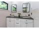 Bright bathroom featuring double vanity, white cabinets and modern rectangular mirrors at 3213 Mid Pines Rd, Raleigh, NC 27606