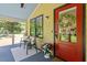 Cozy front porch with seating and a decorative wreath on the red front door at 3213 Mid Pines Rd, Raleigh, NC 27606