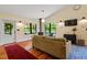 Living room with wood burning stove, hardwood floors, and an inviting atmosphere at 3213 Mid Pines Rd, Raleigh, NC 27606