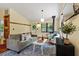 Bright living room with hardwood floors, wood burning stove, and neutral décor at 3213 Mid Pines Rd, Raleigh, NC 27606