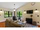 Comfortable living room with wood burning stove, cozy seating, and natural light at 3213 Mid Pines Rd, Raleigh, NC 27606