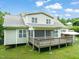 A two-story home featuring a screened in porch and wood deck at 322 Bellemont Rd, Pittsboro, NC 27312