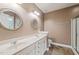 Bathroom features double sinks, decorative mirrors, and a glass shower at 322 Bellemont Rd, Pittsboro, NC 27312