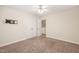 This bedroom features a ceiling fan, carpet, and double door closet at 322 Bellemont Rd, Pittsboro, NC 27312