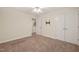 This bedroom features a ceiling fan, carpet, and double door closet at 322 Bellemont Rd, Pittsboro, NC 27312