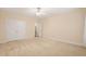 Spacious bedroom with neutral carpet, ceiling fan and closet at 322 Bellemont Rd, Pittsboro, NC 27312