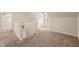 Bonus room features neutral carpet and a window with natural light at 322 Bellemont Rd, Pittsboro, NC 27312