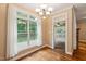 Bright breakfast room with large window and view to the yard and screen porch at 322 Bellemont Rd, Pittsboro, NC 27312