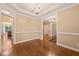 Spacious dining room featuring hardwood floors, a chandelier, and elegant trim at 322 Bellemont Rd, Pittsboro, NC 27312