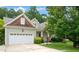 Charming craftsman-style home featuring a two-car garage and well-maintained landscaping at 322 Bellemont Rd, Pittsboro, NC 27312