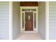 Attractive front door with sidelights offering curb appeal and natural light at 322 Bellemont Rd, Pittsboro, NC 27312